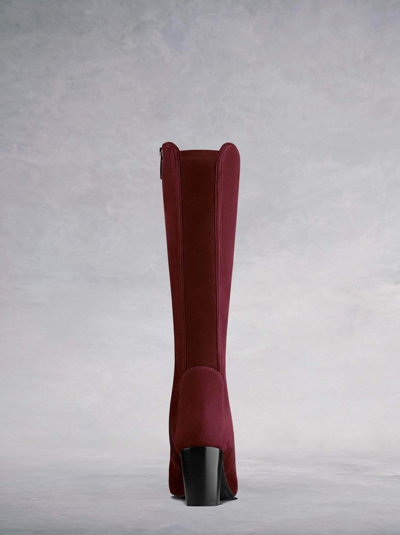 Tailored with a contrasting burgundy stretch suede panel for improved fit.