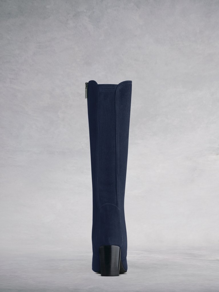 Tailored with a narrow navy stretch suede panel for improved fit.