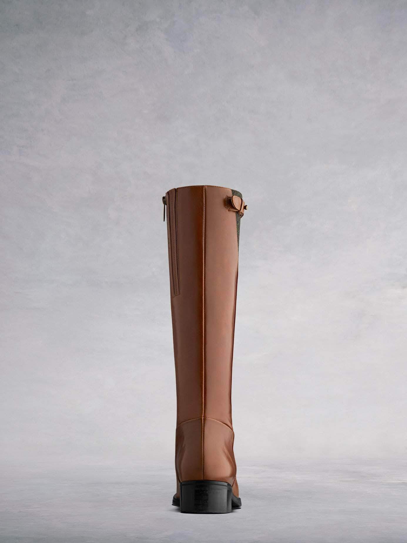 This tan knee high has a straight ankle perfect for women of all sizes.