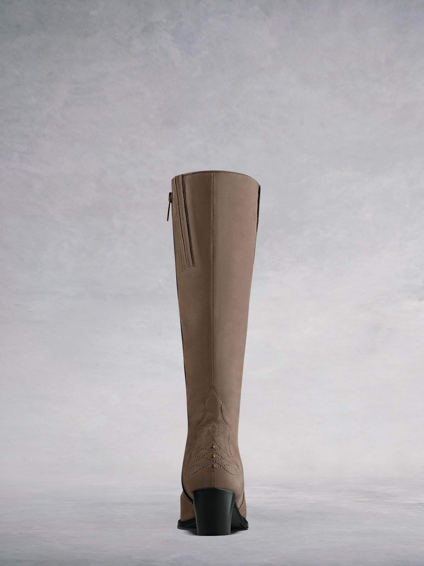 This taupe nubuck Western inspired boot has a burgundy calf leather lining.