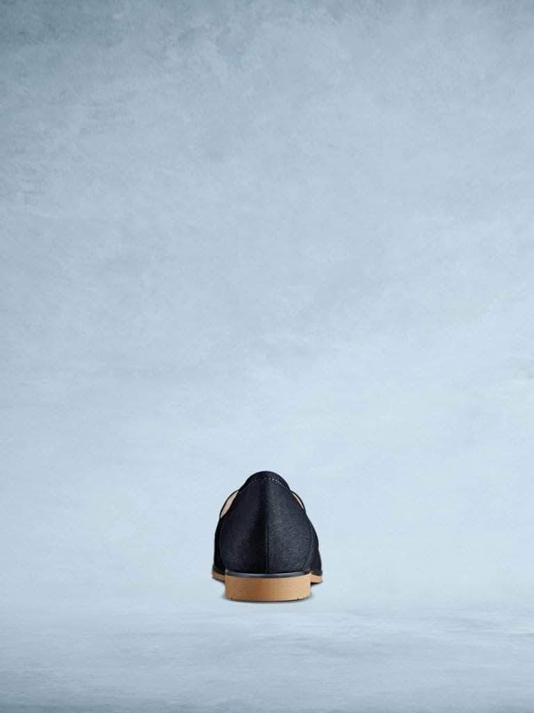 This navy suede pump has a contrast light brown sole.