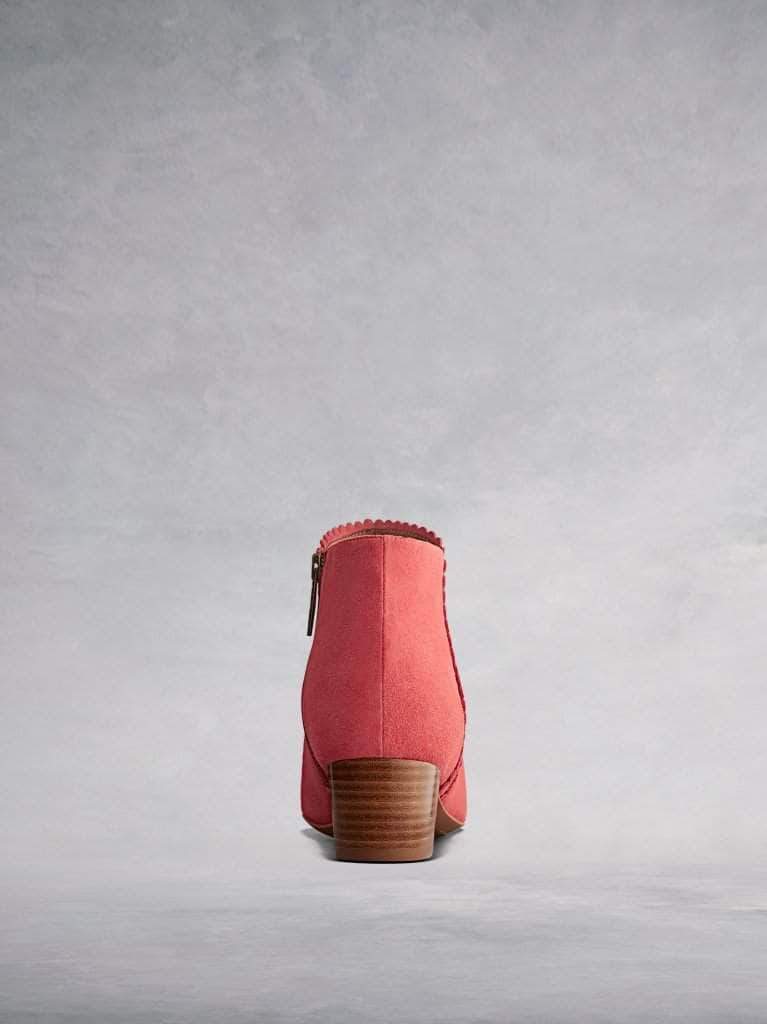 Featuring a stacked brown low block heel makes the ankle boot comfortable and practical.