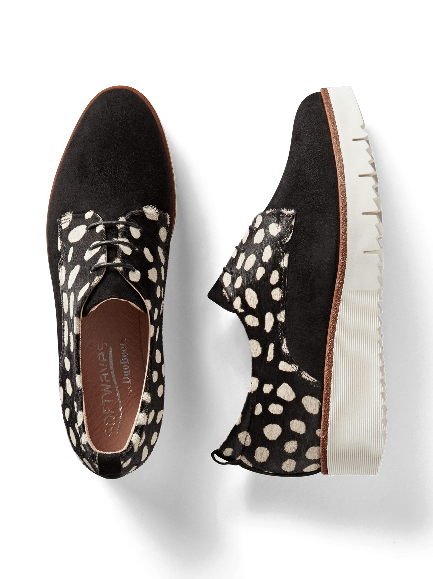 Hayle, our lace-up brogue flatform shoe with black and white spot hair leather.