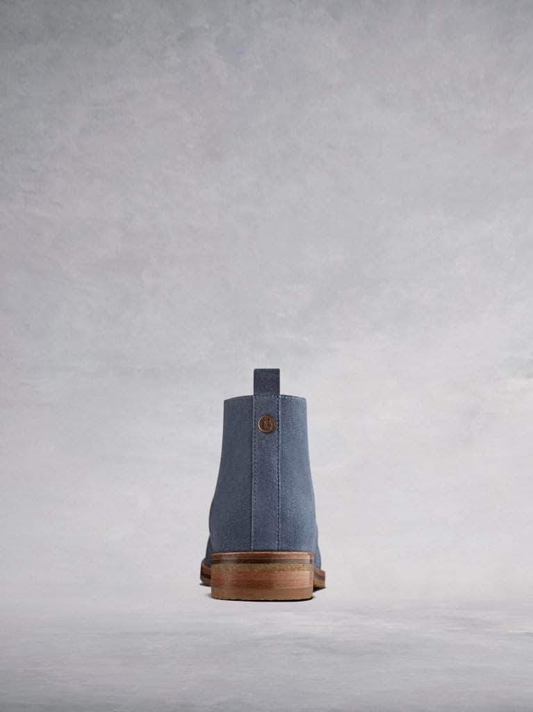The back features our signature stud and pull-tab.
