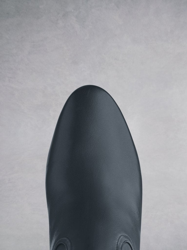 Comfortable round toe shape making this navy boot highly versatile.
