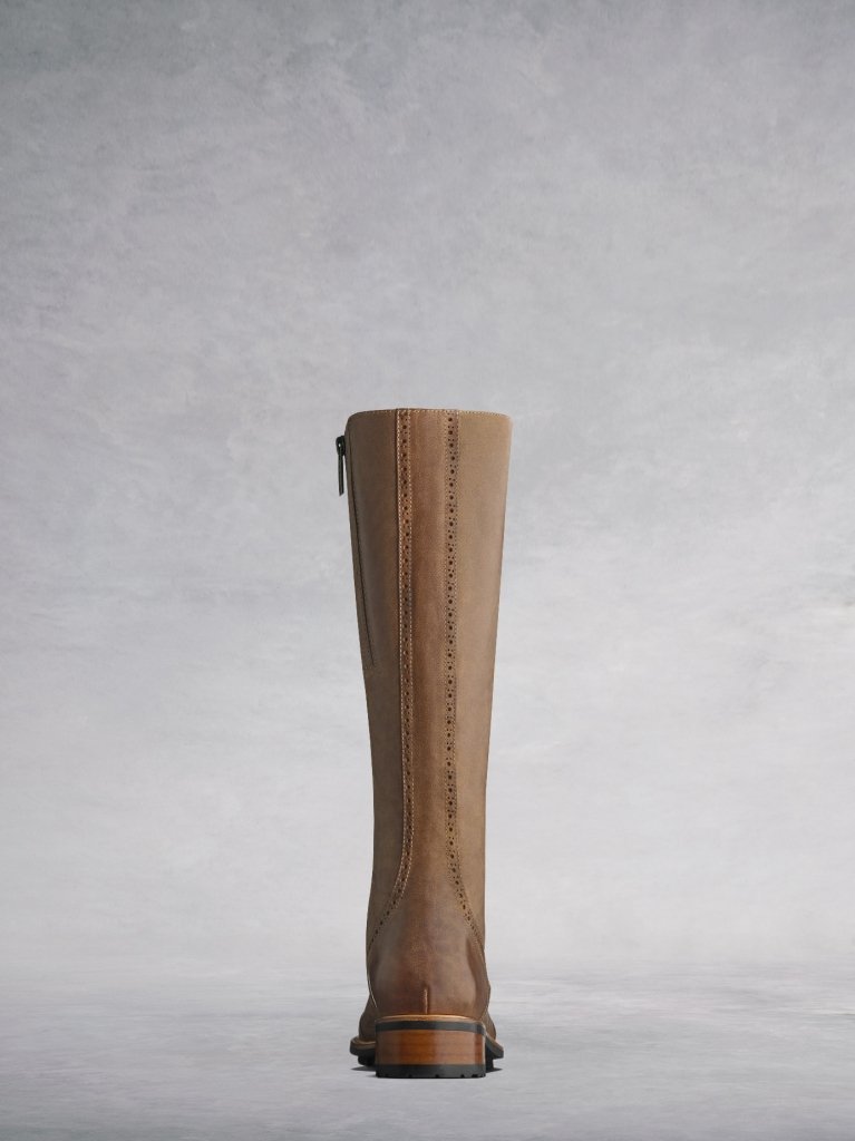 The Marvel in tan has a brown heel and black rubber tread sole.