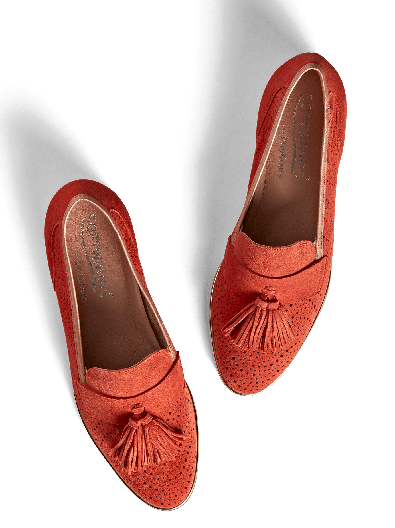 Milford, our flat sole tassel loafer, in perforated coral orange suede.