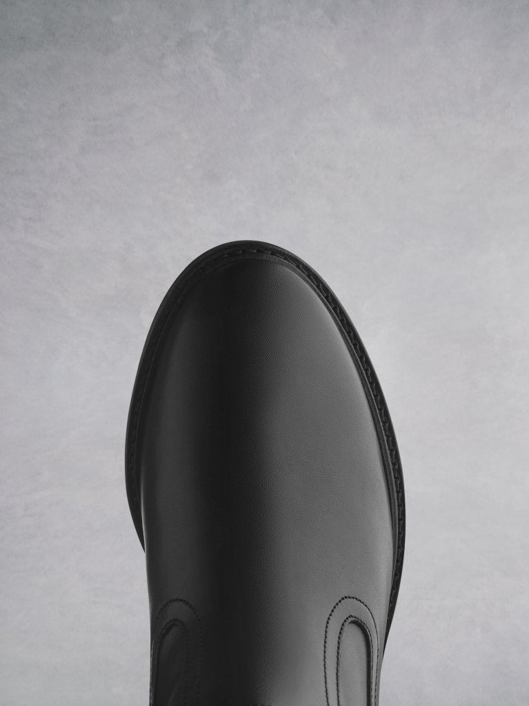 Designed with a slim cut ankle and a comfortable round toe shape.