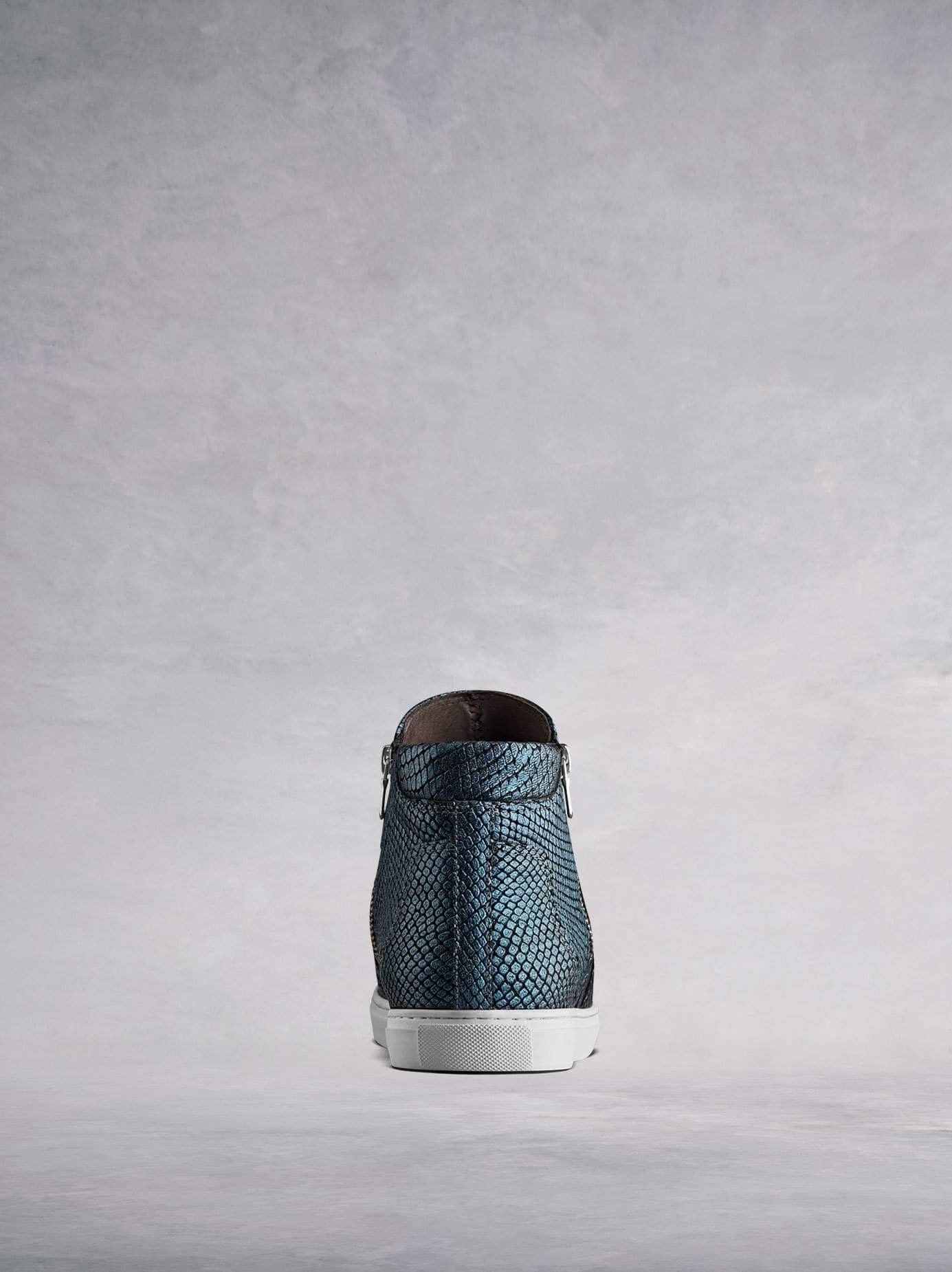 Made from stylish blue snake embossed leather with a contrast white sole.