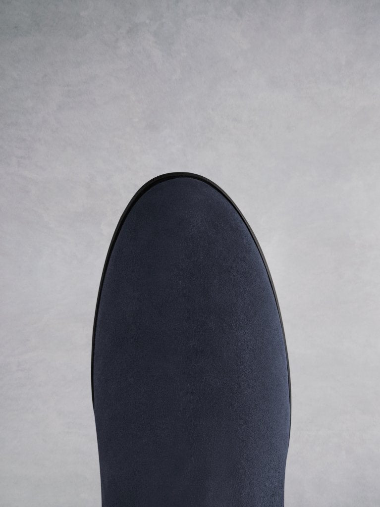 Featuring a navy suede round toe that looks both elegant and classic.
