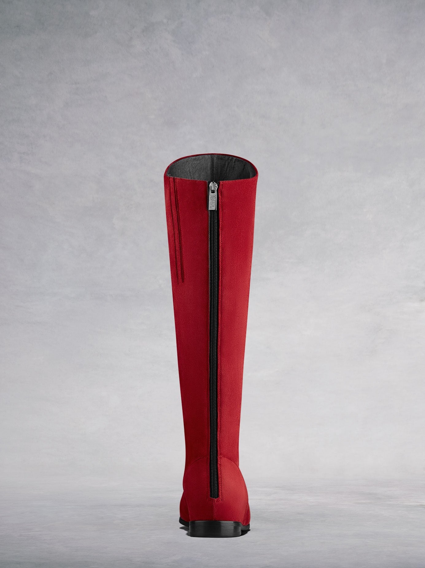 Raven in red has a subtle zip down the back, and an asymmetric topline.