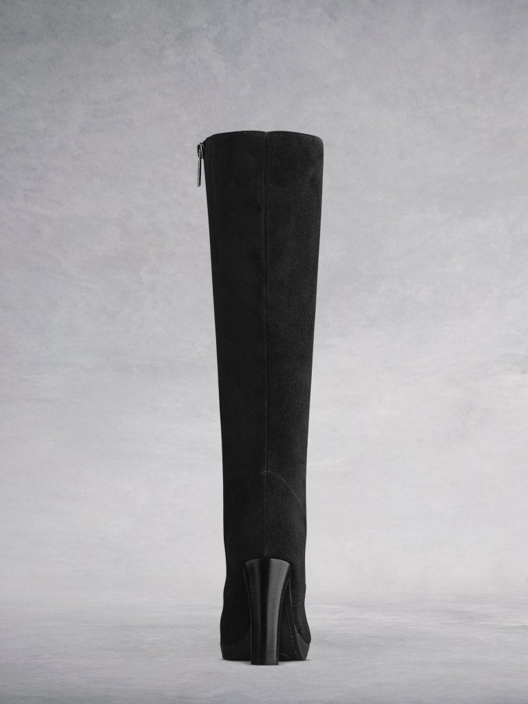 A stacked leather-covered heel and rubber platform sole to add comfort.