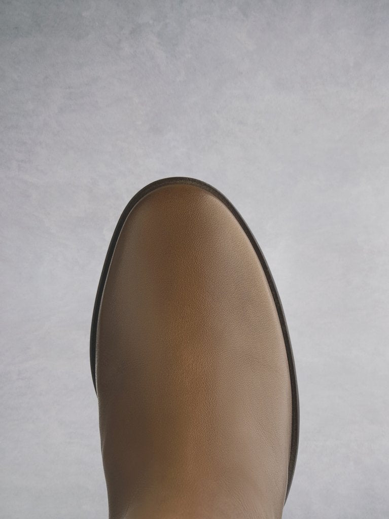 The Siren in tan has a round toe that is both comfortable and practical.