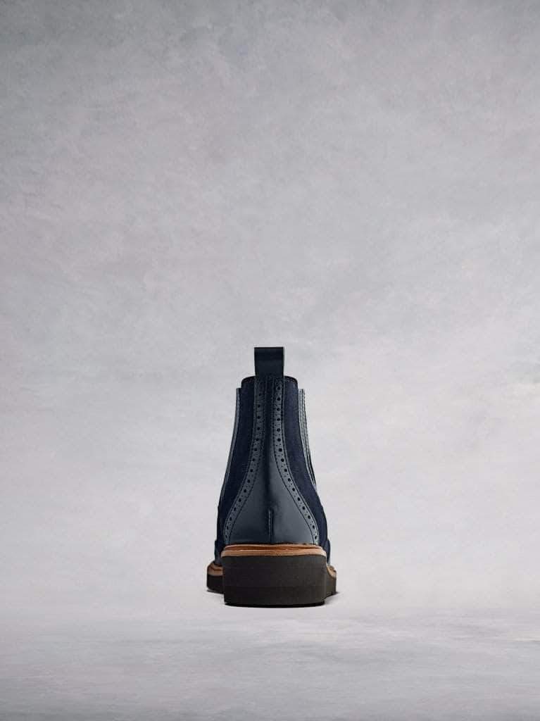 With contrast navy leather broguing and a tan leather trim. 