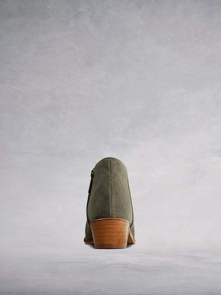 This low cut khaki ankle boot has a flattering curved topline. 
