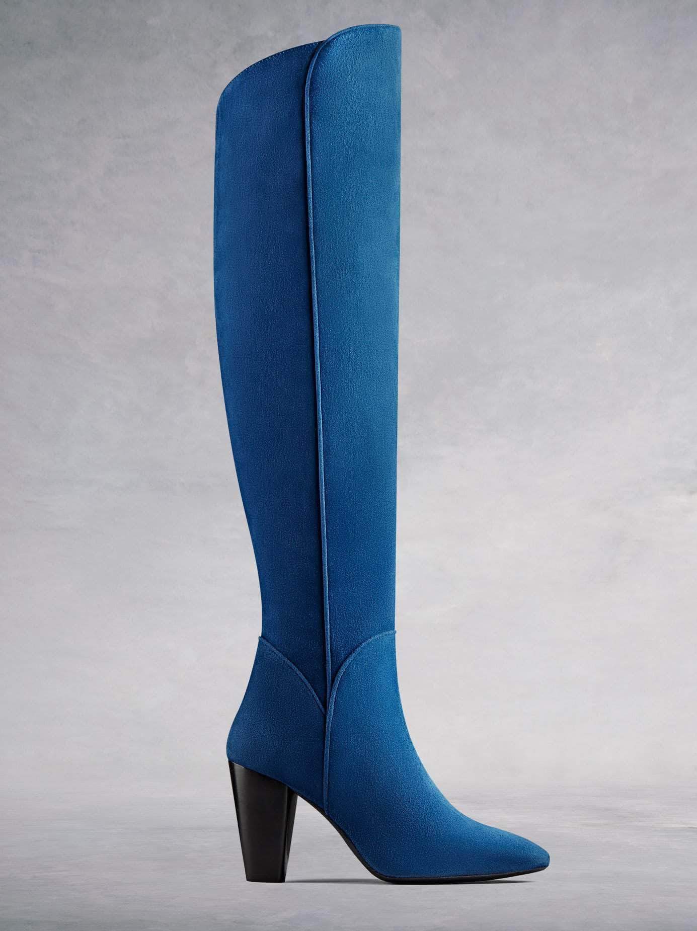 Amery, our statement over the knee high heel boot in luxurious indigo blue kid suede with stylish detailing. Available in a range of calf sizes.