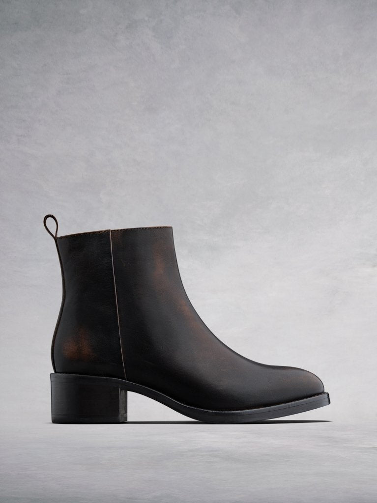 Arietty, a timeless brown leather ankle boot with a classic silhouette. 