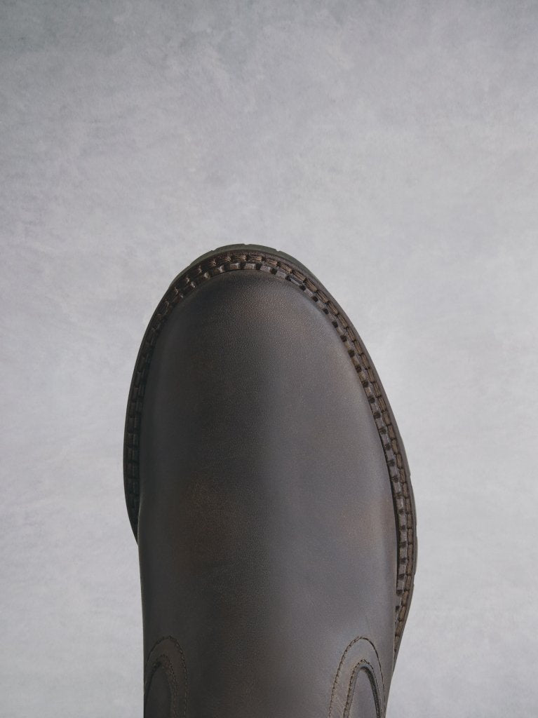 A rounded toe for comfort, with a heavy tread sole for extra grip. 
