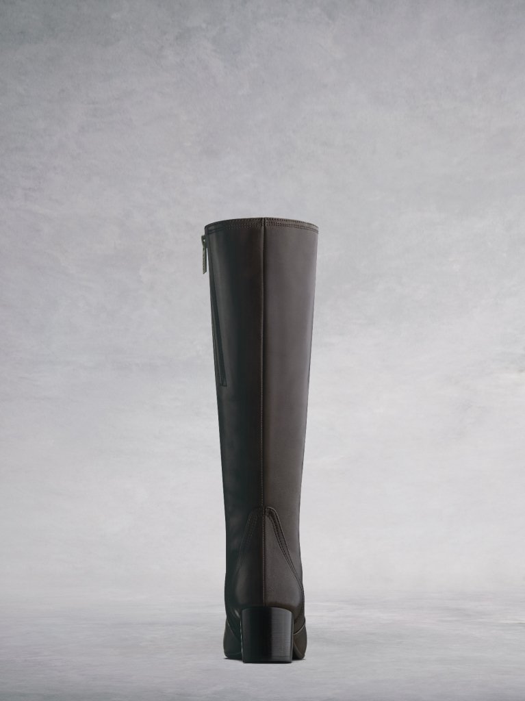 This brown 'Essential' boot has a slim ankle cut and a polished chisel stacked heel. 