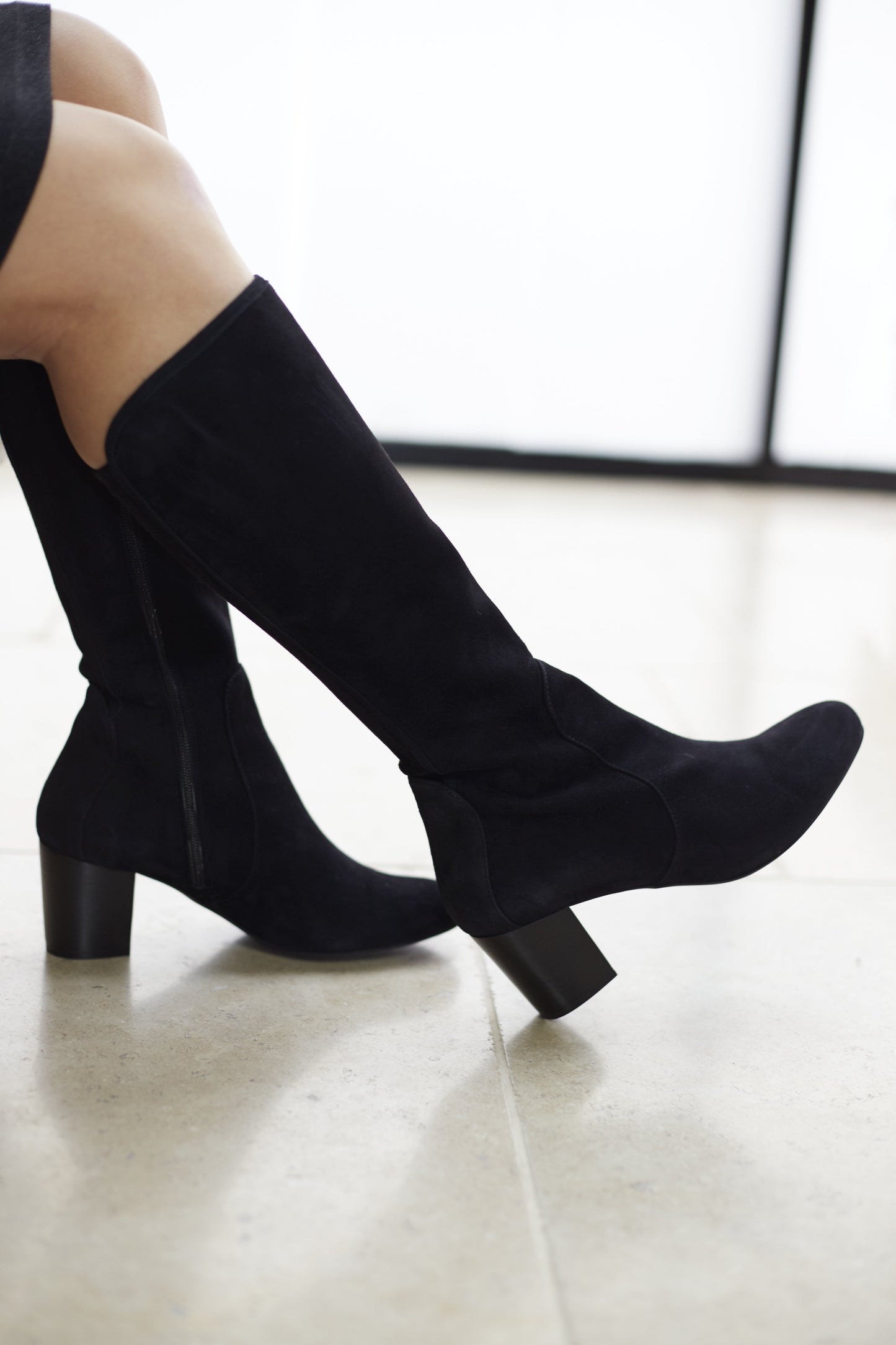 Avocet moulds to the silhouette, and is super chic in burgundy suede.