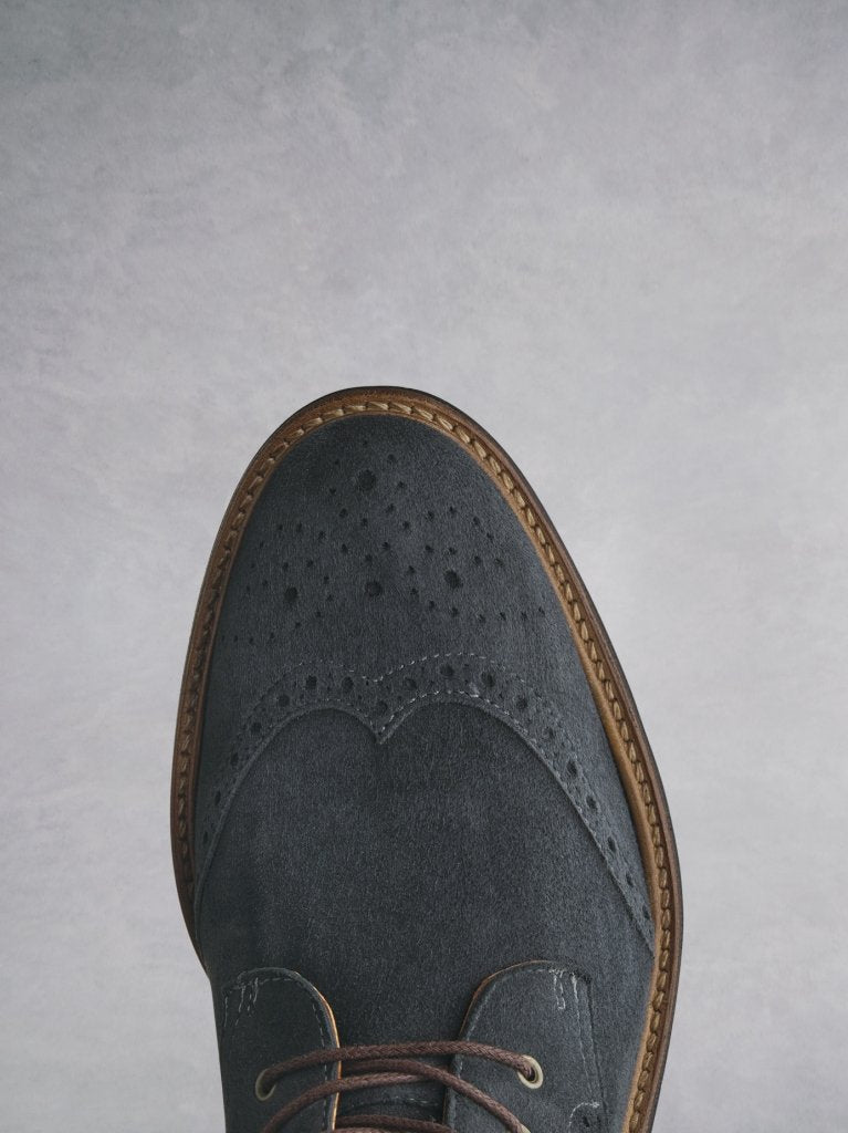 The grey Balla has beautiful brogue detailing over the round shaped toe. 