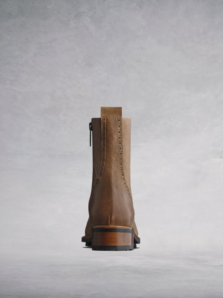 Balla tan has a contrast brown heel against the black rubber tread sole.