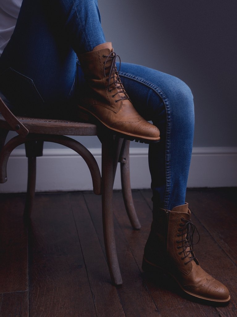 Tan leather ankle boot with a leather trim around the practical rubber tread sole.