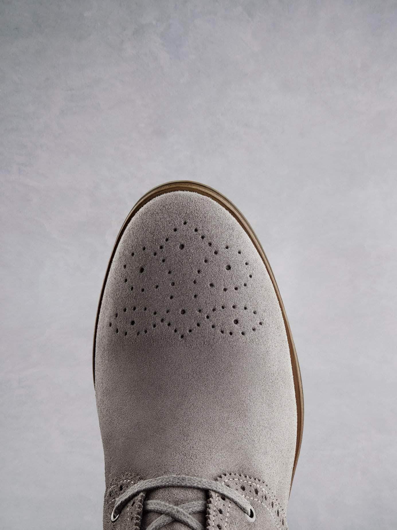 This ankle boot has a dual density sole for extra comfort and a round toe shape.