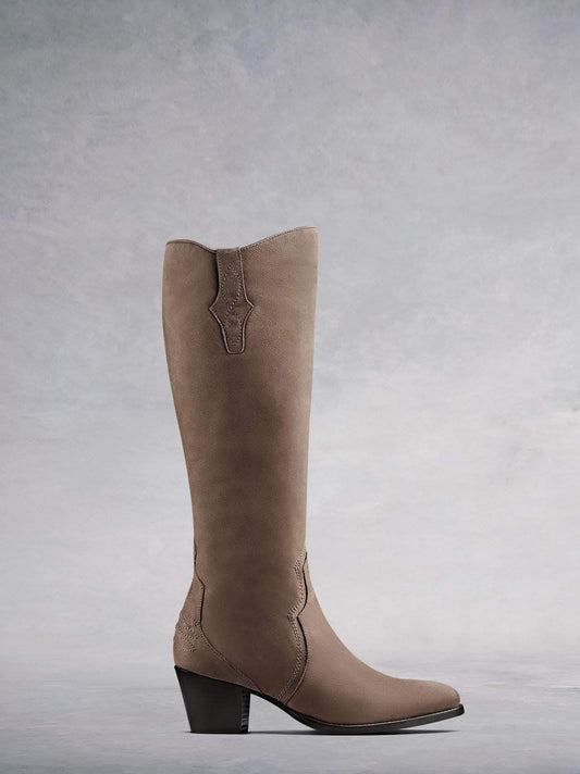 Buckland, our elegant Western-inspired knee high boot crafted from taupe nubuck leather with intricate detailing. Available in a wide range of calf sizes.