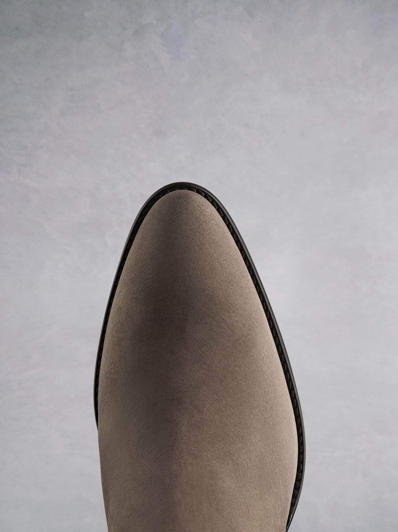 Buckland in taupe features a stylish pointed toe shape inspired by the western style.
