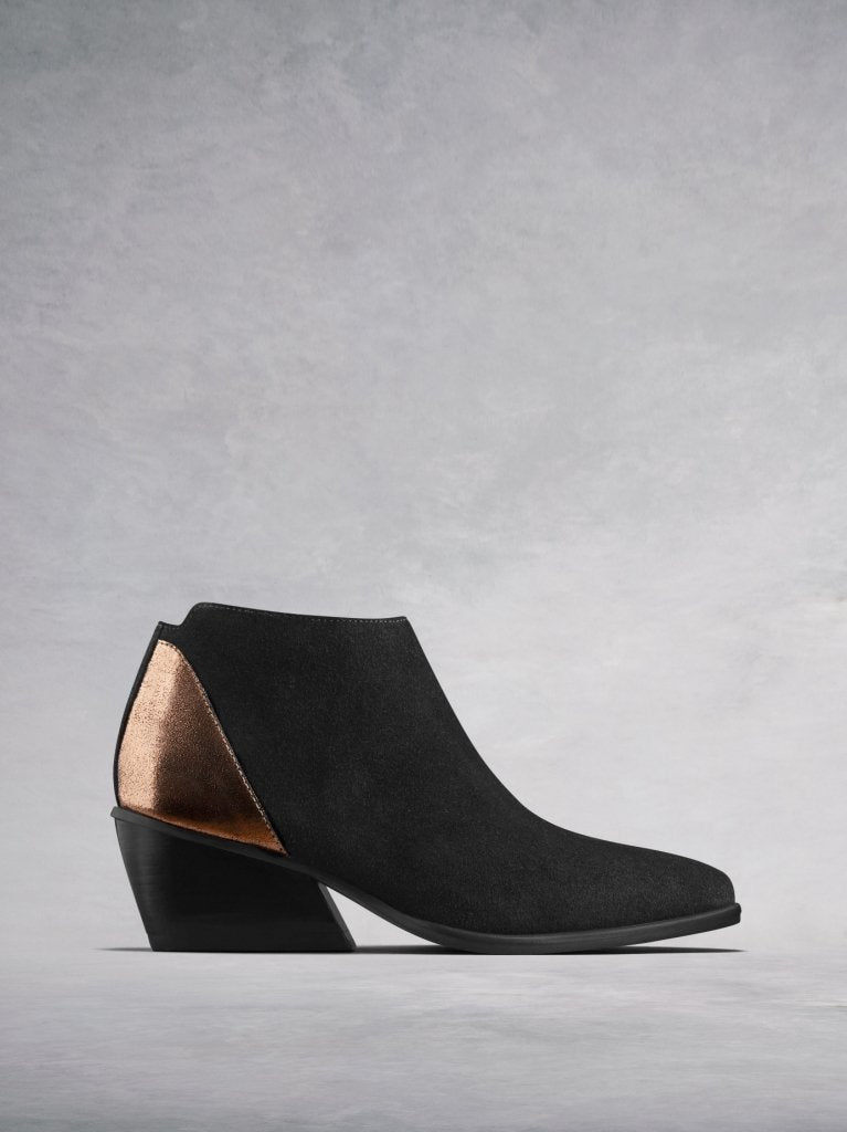 The Buell, our black suede low-cut ankle boot with a metallic counter. 