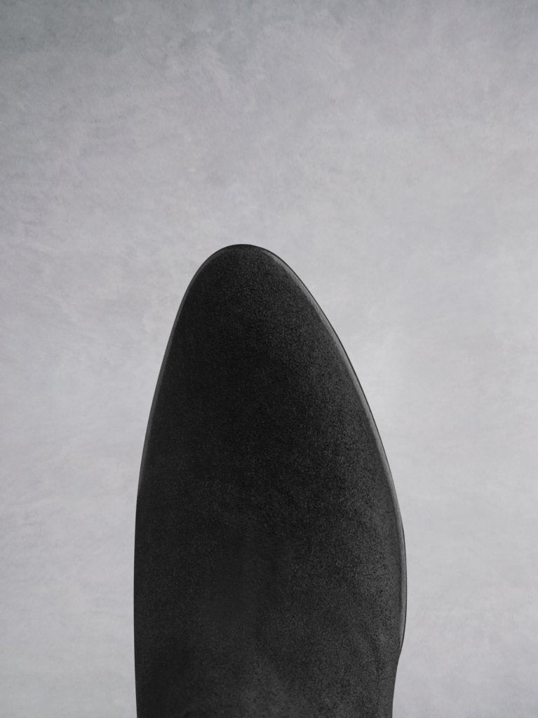 Buell black features an almond toe shape, offset by a unique angular heel.
