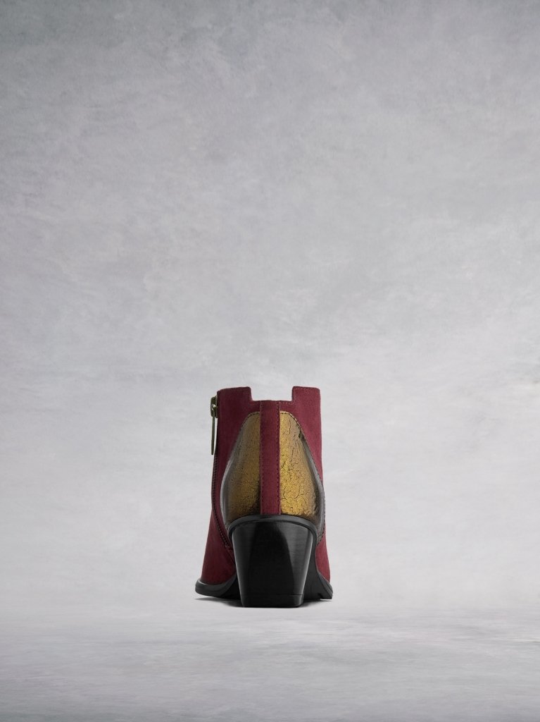 Buell has metallic detailing at the back with a central burgundy panel. 