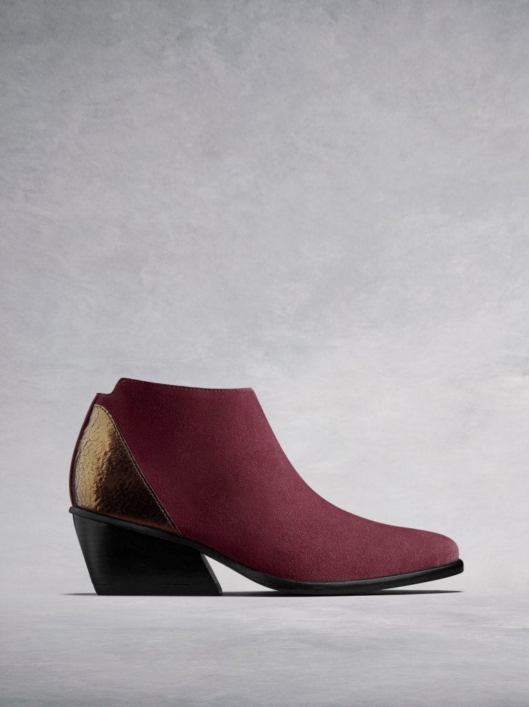Buell, our burgundy suede low-cut ankle boot with a metallic counter. 