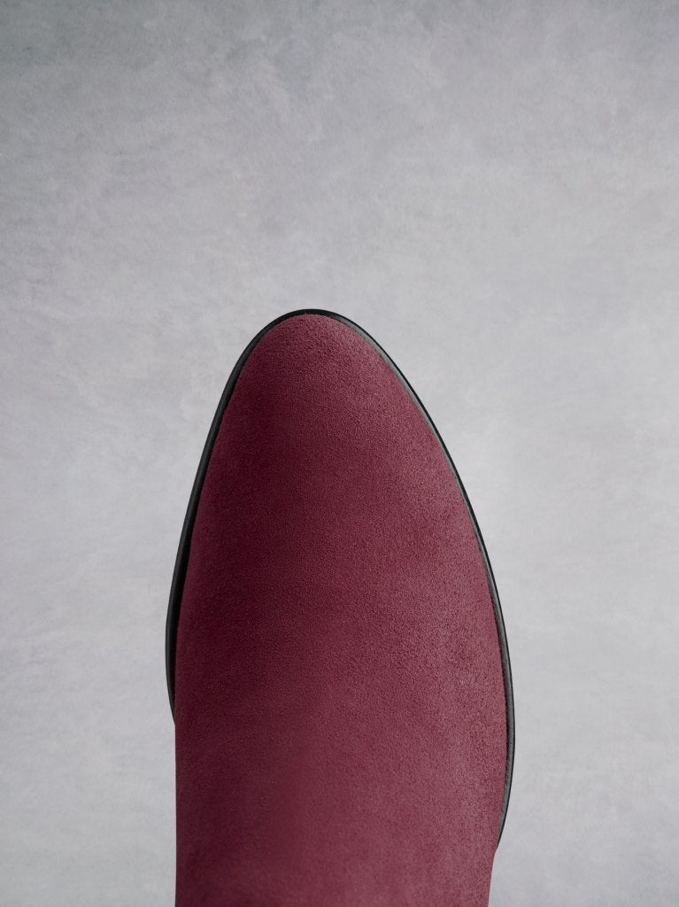 Buell burgundy features an almond toe shape, offset by a unique angular heel.