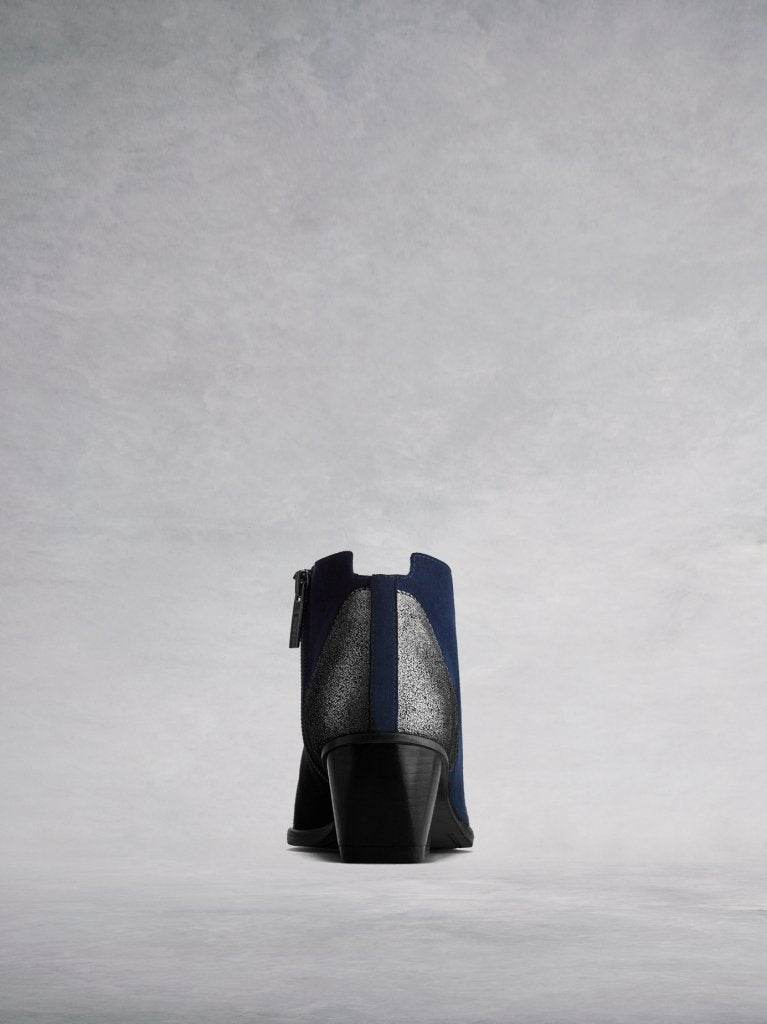 Buell has metallic detailing at the back with a central navy suede panel. 