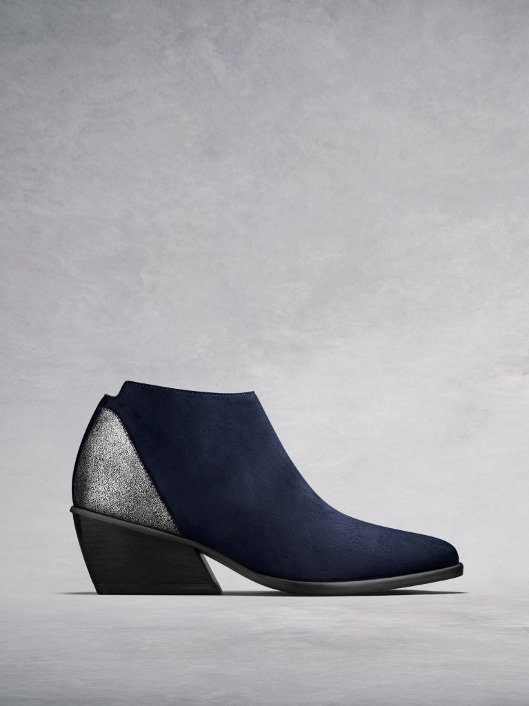 The Buell, our navy suede low-cut ankle boot with a metallic counter. 