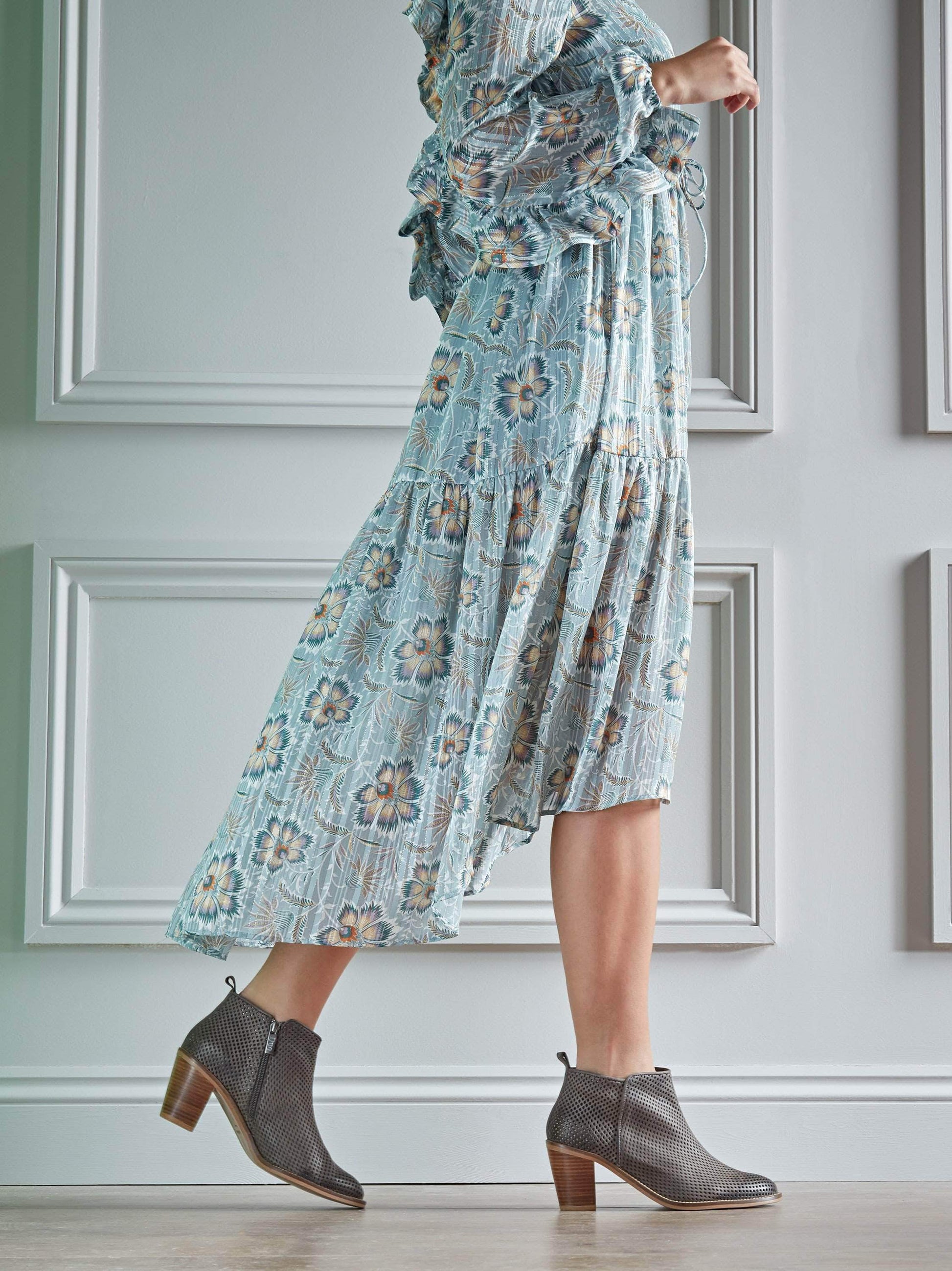 Corsley grey ankle boot with a block Cuban heel and perforation design.