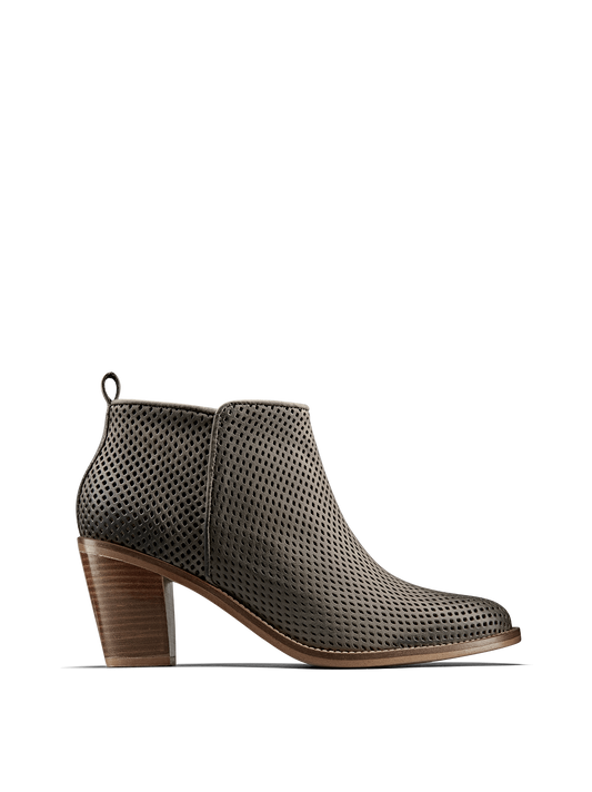 Corsley, a leather boot with a Cuban heel, clean lines and perforation design.