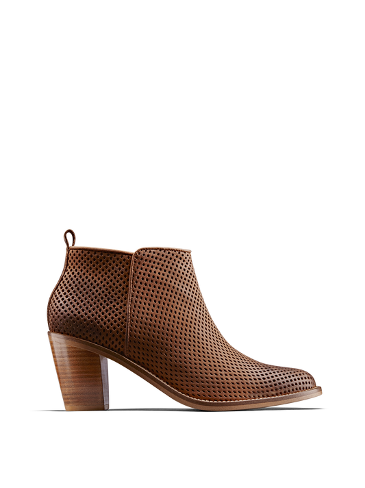 Corsley, a leather boot with a Cuban heel, clean lines and perforation design.