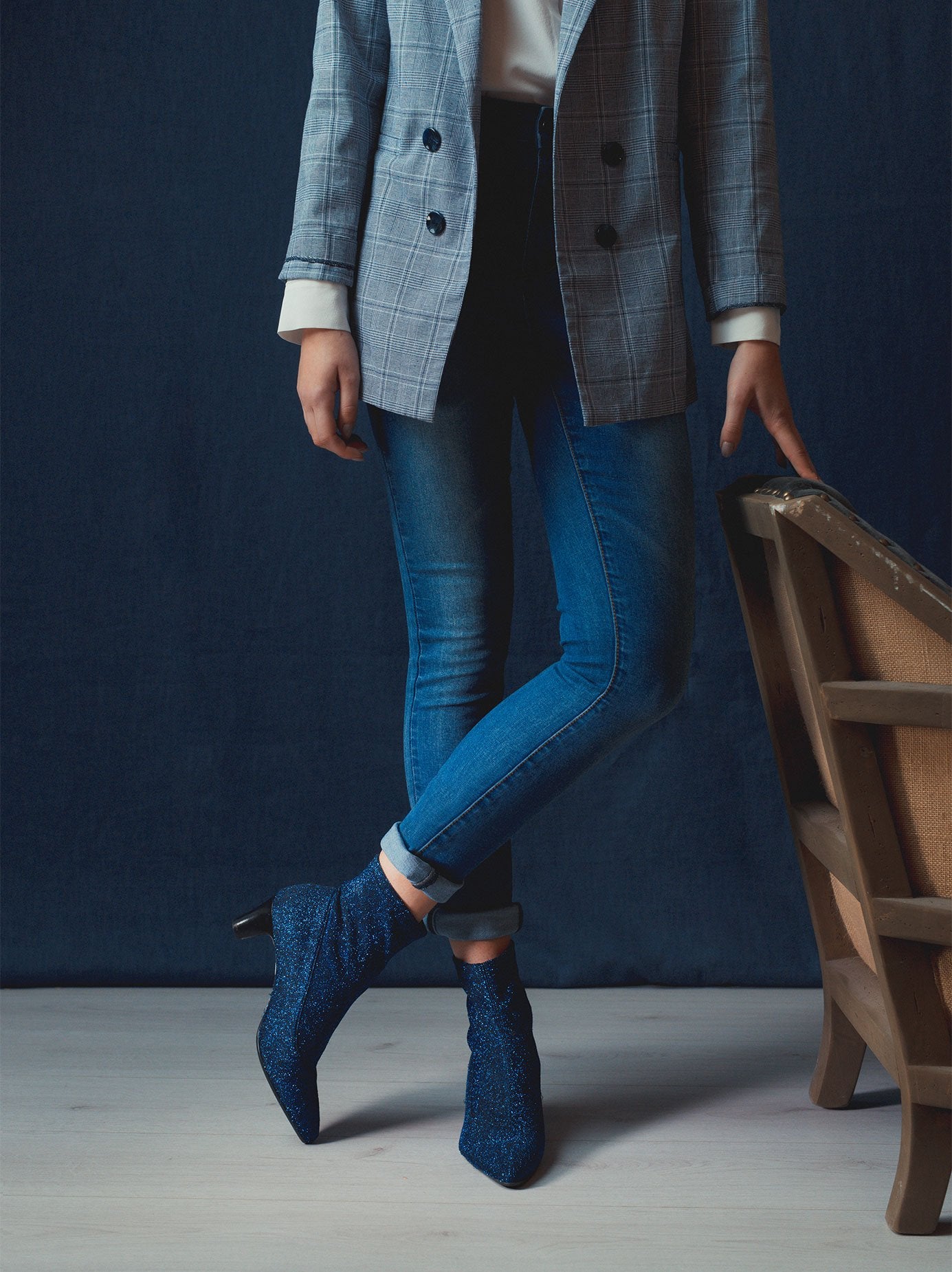 The blue sparkly boot has a fashionable sleek statement  silhouette. 