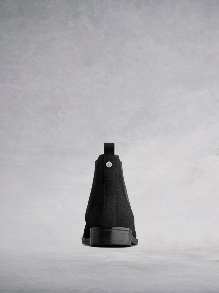 The back features a narrow black suede panel and pull-tab. 