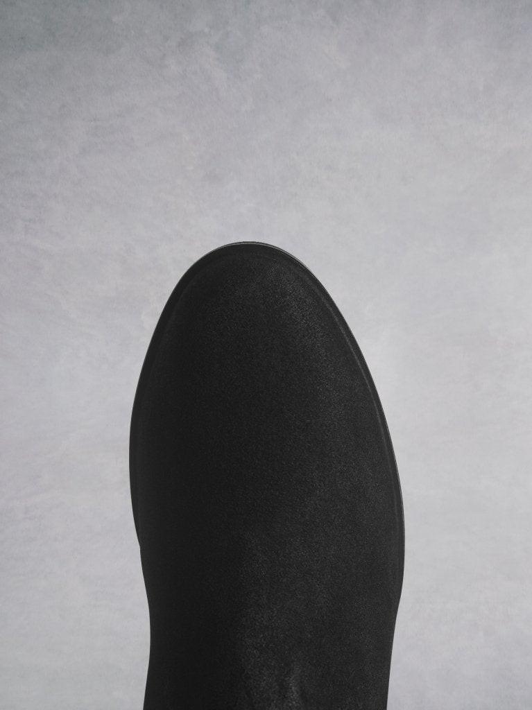 The Darwin black has a comfortable round toe and a crepe look sole.