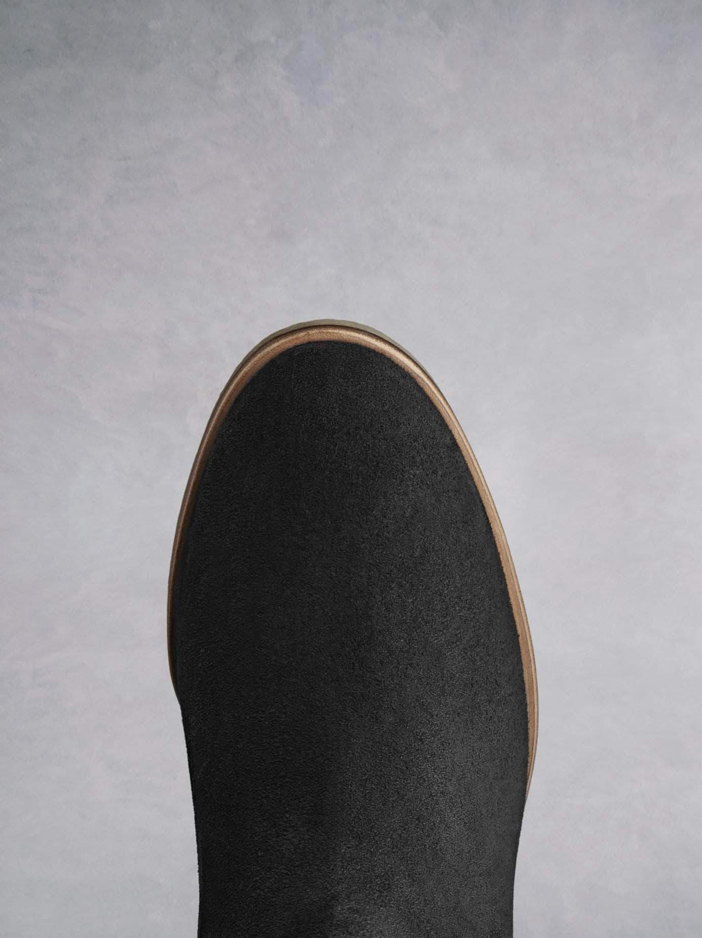 Darwin black has a comfortable round toe and a crepe look sole.