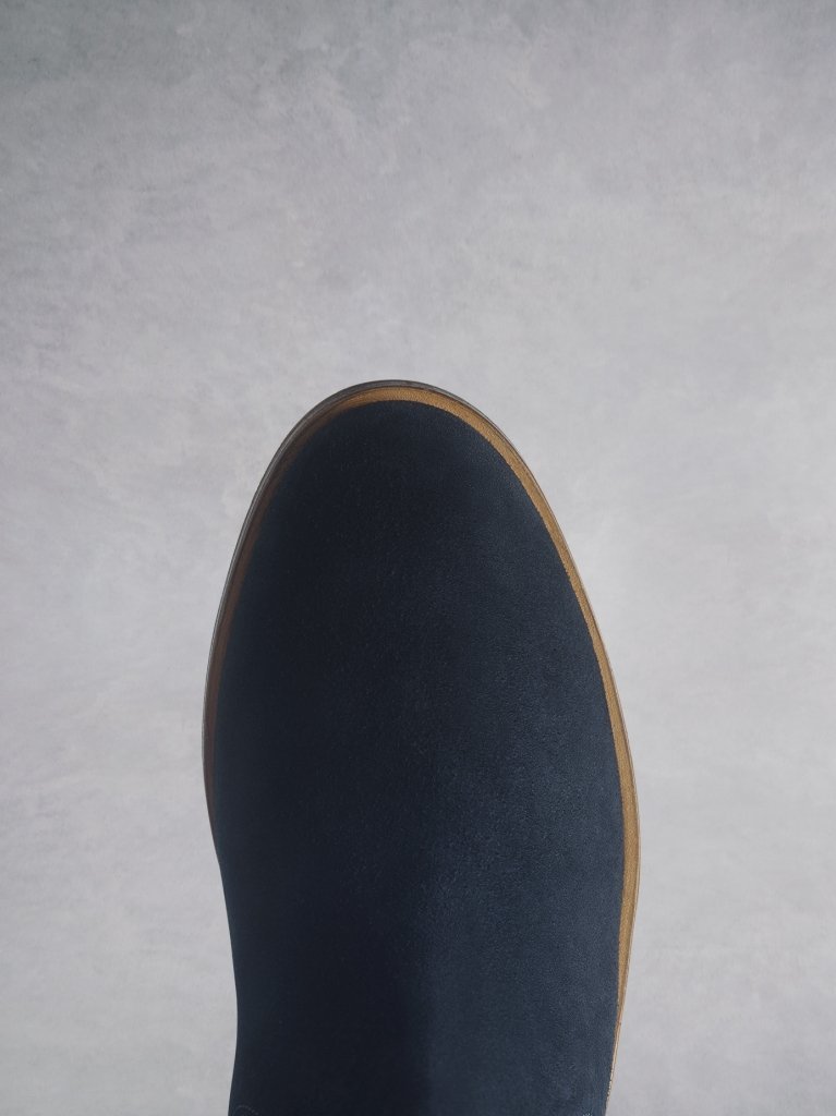 The Darwin navy has a comfortable round toe and a crepe look sole.