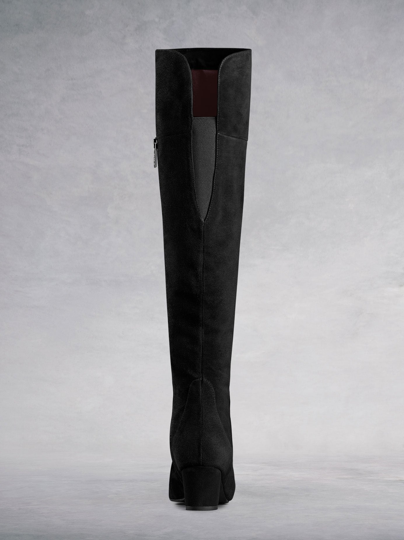 Tailored with a slim elastic panel at the back, and low black block heel. 