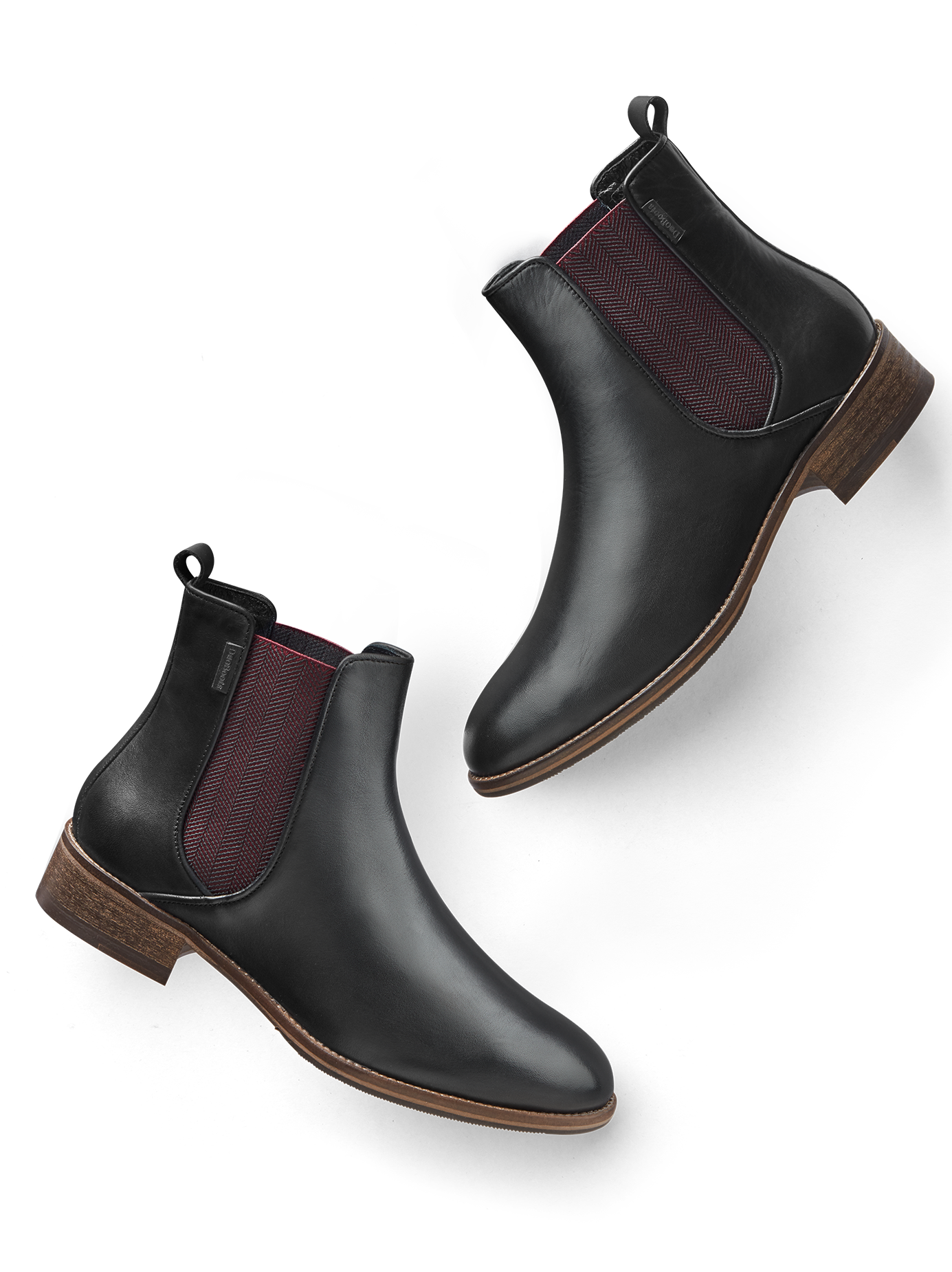 Grove in black leather, with a contrasting burgundy herringbone elastic panel.