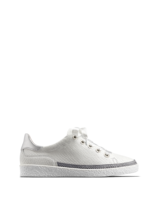 Harlyn, our statement white leather trainer with side zip fastening.