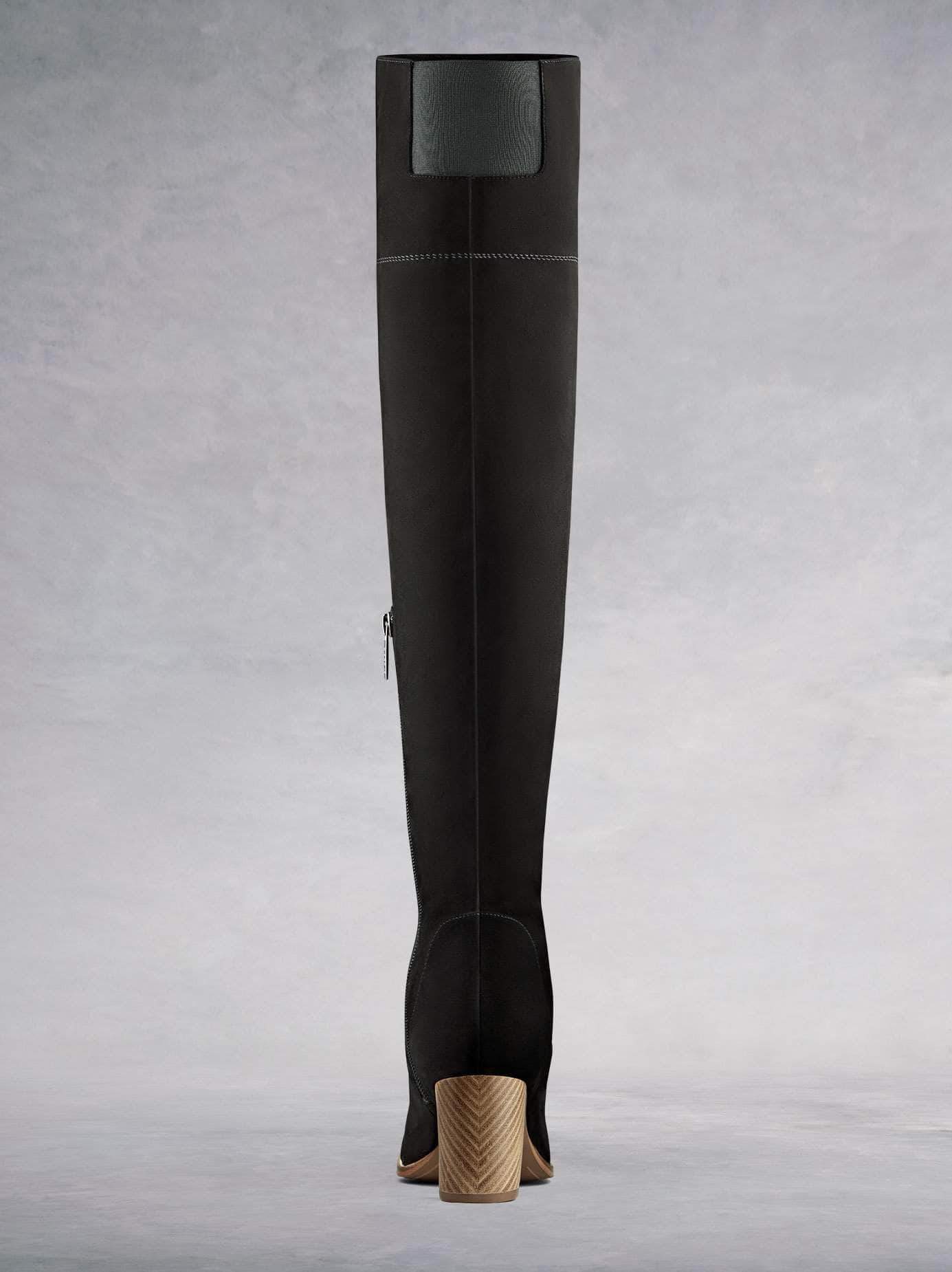 This black suede boot has a matching elastic back panel for improved fit.