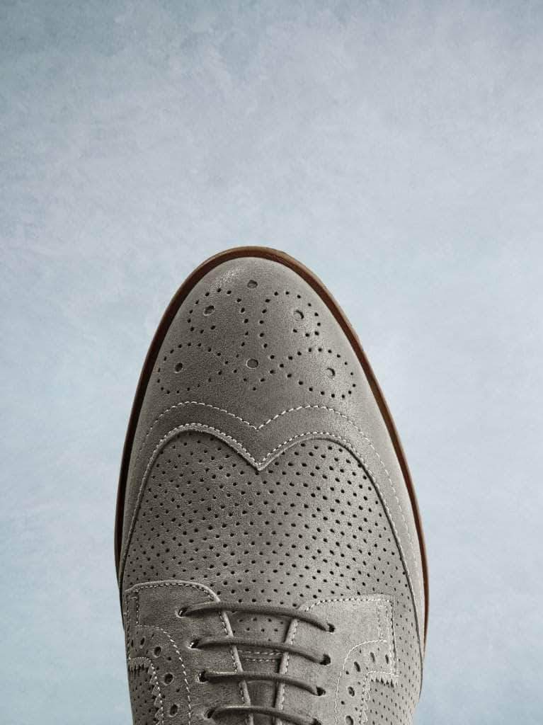 Featuring a stylish khaki almond toe complemented by brogue detailing.